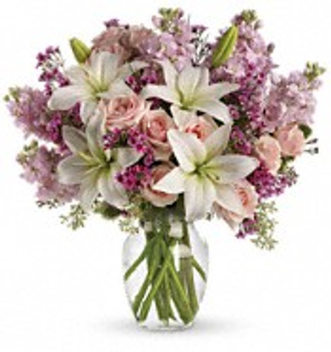 A romantic mixture of fresh flowers in valentine colors of pink, lavender,  and white.